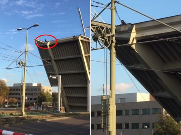 Homem ficou agarrado a ponte levadiça sobre canal na Holanda (Foto: Reprodução/YouTube/ Fred Berk)
