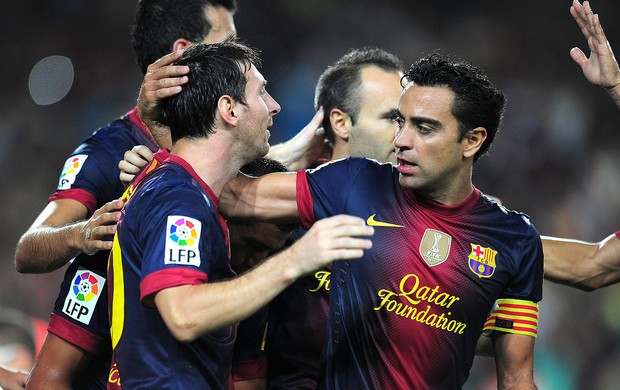 Messi, Xavi e Iniesta, Barcelona x Real Madrid (Foto: Agência AFP)