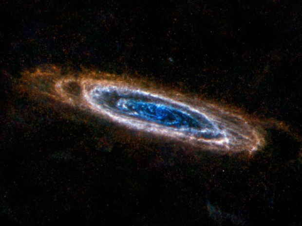 Nuvens de poeira ao redor da galáxia Andromeda (Foto:  ESA/NASA/JPL-Caltech/NHSC)