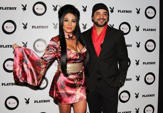 Natalia Inoue e o namorado Diguinho, do grupo Katinguelê (Foto: Celso Tavares / EGO)