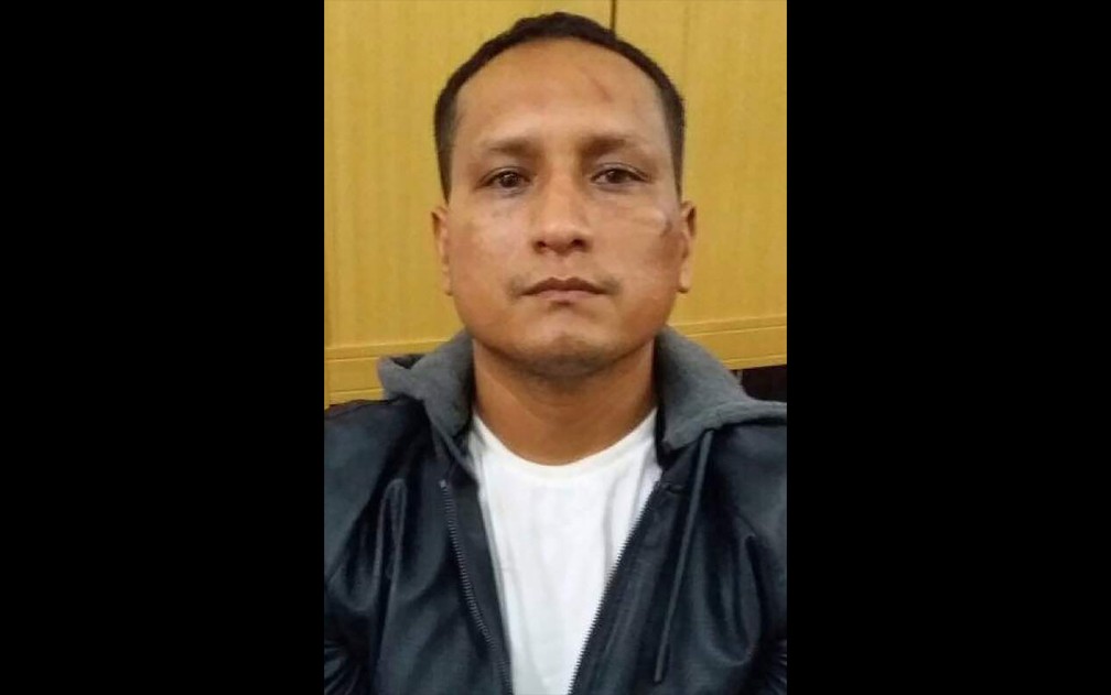 Foto divulgada pela polícia da Indonésia do peruano Jose William Salazar Ortiz. Acusado de roubar caixas eletrônicos, ele fugiu do tribunal pela janela do banheiro  (Foto: Handout / INDONESIA POLICE / AFP)