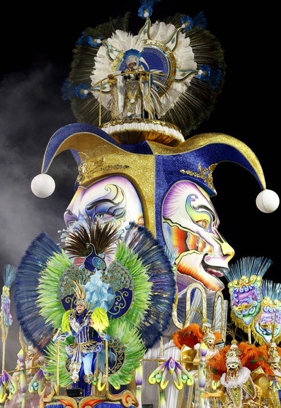 Dancers from the Academicos do Tucuruvi samba school perform on a float during the Carnival parade at the Sambodromo in Sao Paulo, Brazil, Friday, Feb. 13, 2015. (AP Photo/Andre Penner)