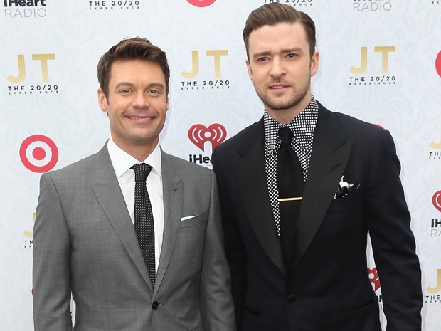 O apresentador Ryan Seacrest e o cantor Justin Timberlake na festa de lançamento de 'The 20/20 experience' em Los Angeles (Foto: David Livingston/Getty Images/AFP)