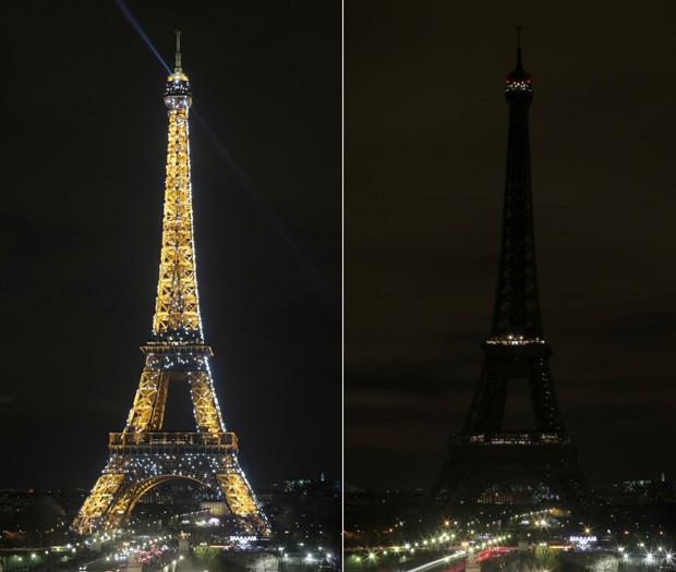 Em Paris, a torre Eiffel quase desaparece sem iluminação (Foto: Jacques Demarthon / AFP)