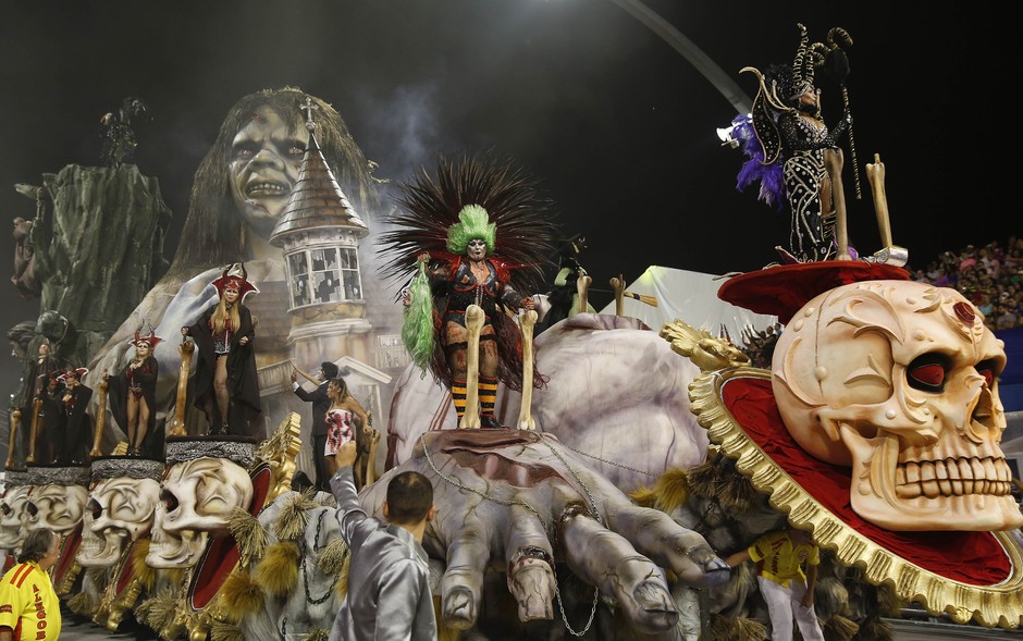 Dancers from the Tom Maior samba school perform on a float during the Carnival parade at the Sambodromo in Sao Paulo, Brazil, Friday, Feb. 13, 2015. (AP Photo/Andre Penner)