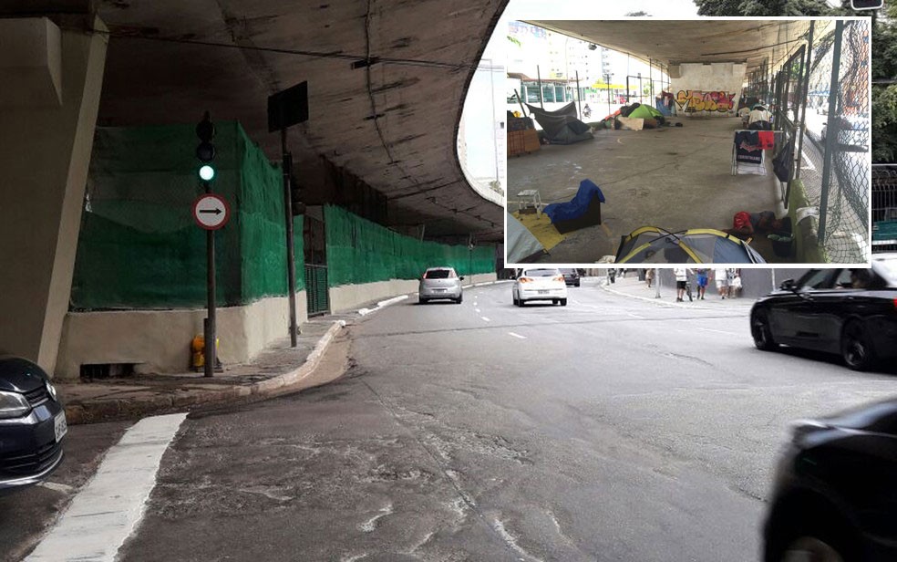  Tela verde foi instalada nesta quinta (5), em área onde foram realocados moradores de rua no Centro (no detalhe, os moradores de rua no local na terça-feira (4) (Foto: Kleber Ribeiro/Arquivo pessoal e Will Soares/G1)