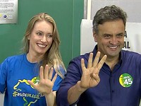 Aécio Neves vota em BH ao lado da mulher (Reprodução/Globo News)