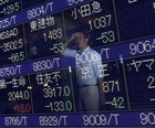 Queda na indústria chinesa derruba bolsas (Issei Kato/Reuters)