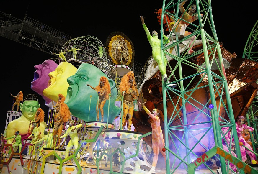 Dancers from the Tom Maior samba school perform on a float during the Carnival parade at the Sambodromo in Sao Paulo, Brazil, Friday, Feb. 13, 2015. (AP Photo/Andre Penner)