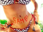 Karina Bacchi cai na folia e escreve 'Samba' na barriga de grávida