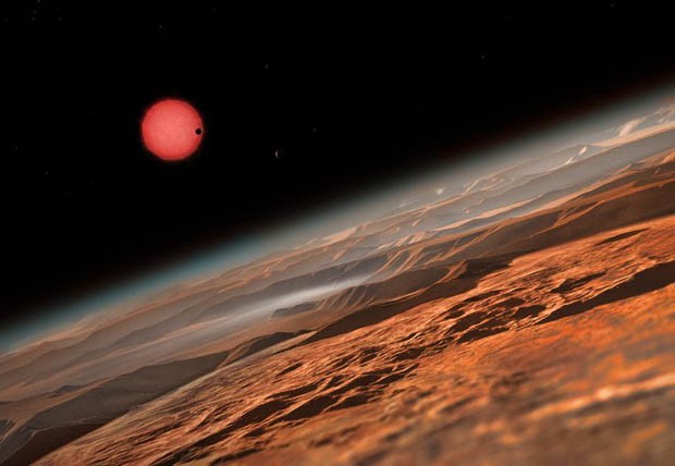 Ilustração da vista imaginada próximo à superfície de um dos três planetas que orbitam uma estrela anã. (Foto: ESO/M. Kornmesser) Ilustração da vista imaginada próximo à superfície de um dos três planetas que orbitam uma estrela anã. (Foto: ESO/M. Kornmesser)