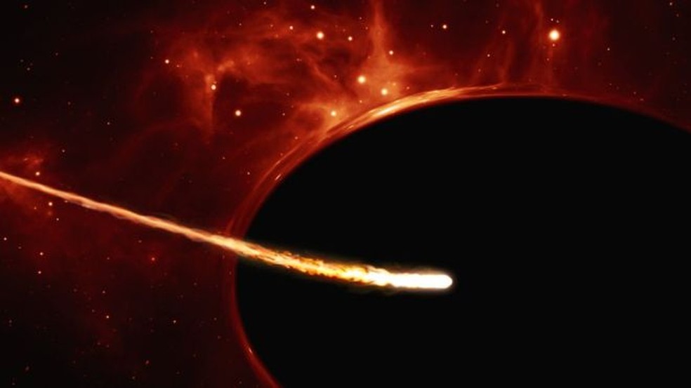 Desenho representa uma estrela parecida com o Sol sendo despedaçada por um buraco negro (Foto: ESA/Hubble, ESO, M. Kornmesser)