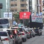 Buzinaço e trio elétrico divulgam evento na praia (Natália Souza/G1)