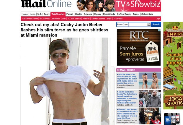 Justin Bieber mostra abdômen ao perceber que estava sendo clicado por fotógrafos (Foto: Daily Mail/Reprodução)