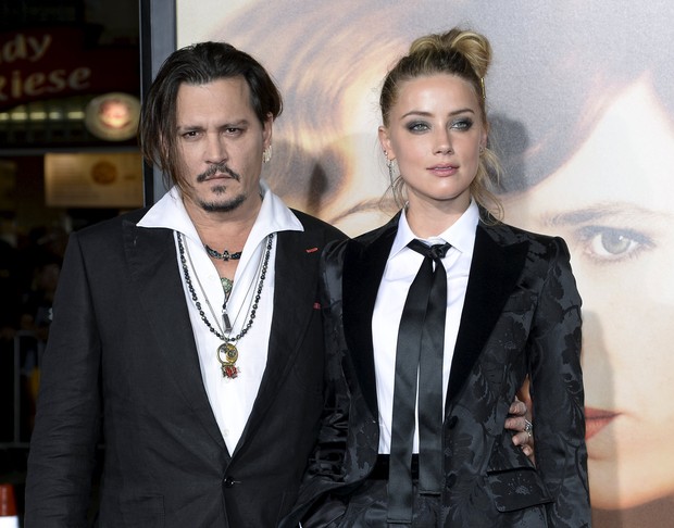 Johnny Depp e a mulher, Amber Heard, em première de filme em Los Angeles, nos Estados Unidos (Foto: Kevork Djansezian/ Reuters)