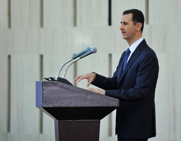  Foto divulgada pela agência Sana mostra o presidente Bashar al-Assad em um discurso pronunciado durante um 'iftar', refeição feita na última semana do Ramadã. (Foto:   AFP Photo/HO/Sana)