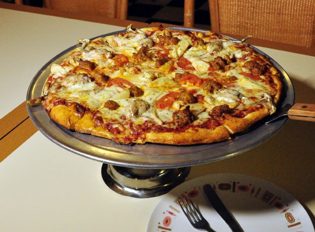 Pizza Everglades é feita com carne de píton (Foto: Guillaume Meyer/AFP)