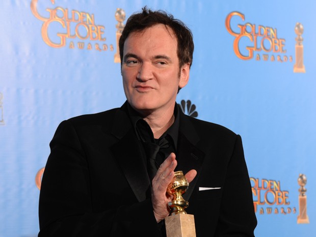 Cineasta Quentin Tarantino levou o prêmio de melhor roteiro original por 'Django livre' no Globo de Ouro 2013 neste domingo (13) (Foto: Robyn Beck/AFP)