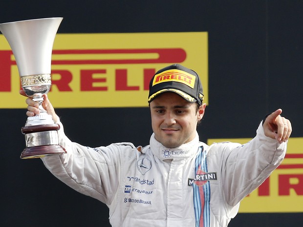 Felipe Massa, piloto brasileiro da Williams, comemora o pódio no GP de Monza da F-1. Ele ficou em terceiro, atrás de Lewis Hamilton e Nico Rosberg, da Mercedes (Foto: Antonio Calanni/AP)