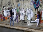 Grafites feitos por Justin Bieber são apagados de muro