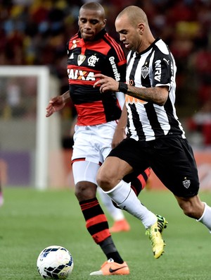 Marcelo Flamengo e Diego tardelli Atlético-MG Brasileirão (Foto: Agência Getty Images) Marcelo Flamengo e Diego tardelli Atlético-MG Brasileirão (Foto: Agência Getty Images)