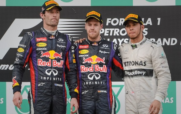 Mark Webber, Sebastian Vettel e Lewis Hamilton no pódio do GP da Malásia (Foto: AFP)