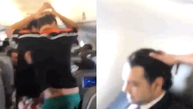 Homens dançam ao lado da poltrona de Marco Feliciano em voo (Foto: Youtube/ WAPTV Comunicação Comunicação)
