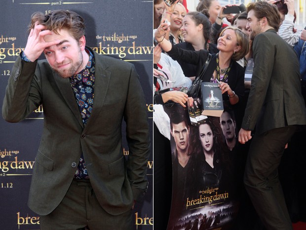 Robert Pattinson posa com fãs durante lançamento de 'A saga Crepúsculo: Amanhecer - parte 2' em Sydney, na Austrália, nesta segunda-feira (22) (Foto: AP/Rob Griffith)