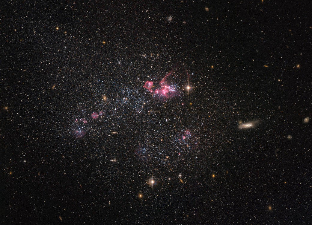 Fotografia do sistema UGC 4459 feita pelo Hubble (Foto: Divulgação/Nasa e ESA)