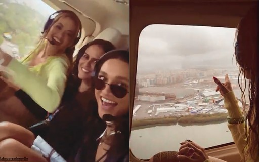 Débora Nascimento chega de helicóptero com Rita Ora e curte Rock in Rio com amigos
