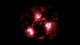 A galáxia está passando por uma explosão de formação estelar, iluminando o gás ao seu redor. Nuvens espessas de poeira obscurecem a maior parte da luz, fazendo com que pareça fraca e desorganizada, muito diferente das galáxias vistas hoje. (Foto: ALMA/James Josephides/Christina Williams/Ivo Labbe)