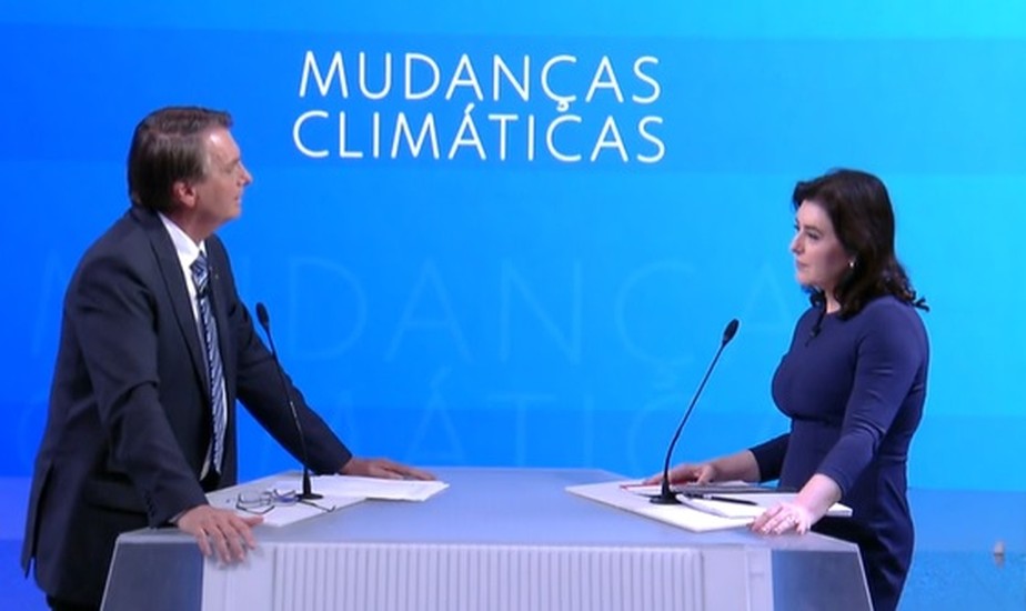 O presidente Jair Bolsonaro e a senadora Simone Tebet durante debate da TV Globo