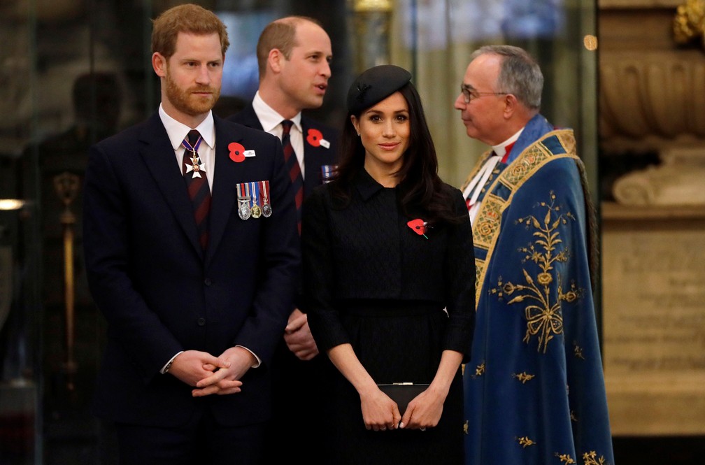 Príncipe William, príncipe Harry e sua noiva, Meghan Markle, durante cerimônia na abadia de Westminster, na quarta-feira (25)  (Foto: Kirsty Wigglesworth/ Reuters)