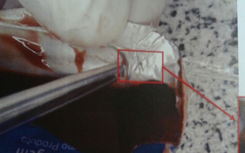 Caixinha de acholatado foi perfurada para que fosse colocado o veneno (Foto: Reprodução)