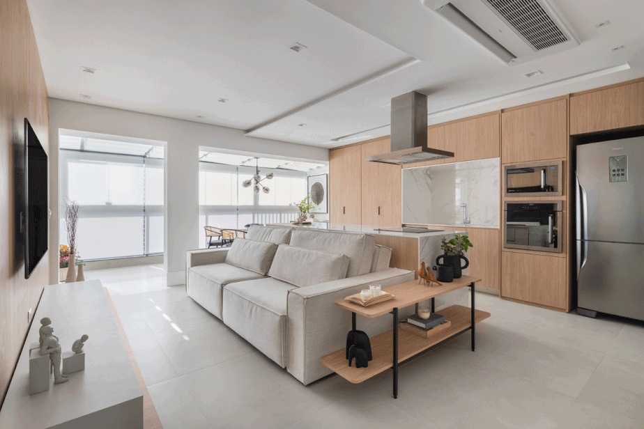 LIVING | A ilha é o ponto central do living integrado no apartamento de 140 m² e reformado pelo escritório FPBF Arquitetura