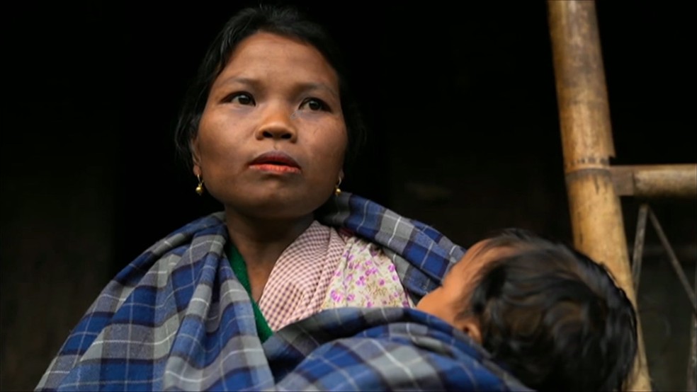 Mulher no vilarejo Kong Thong — Foto: BBC News