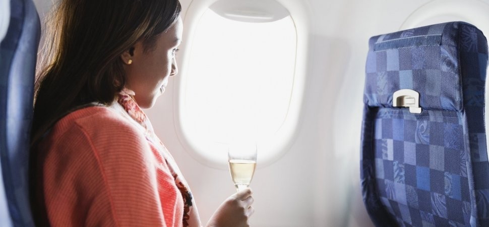 Mulher em um avião (Foto: Getty Images)