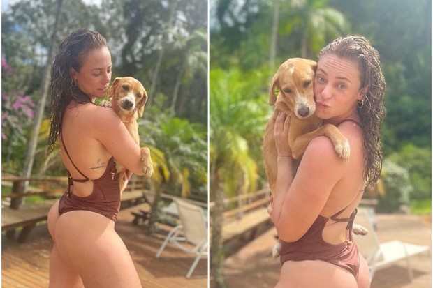 De maiô, Paolla Oliveira posa com cachorrinho em dia de sol