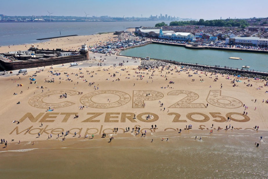 Inscrição na areia de New Brighton Beach, no Reino Unido: todos de olho na conferência climática global da ONU, a COP26