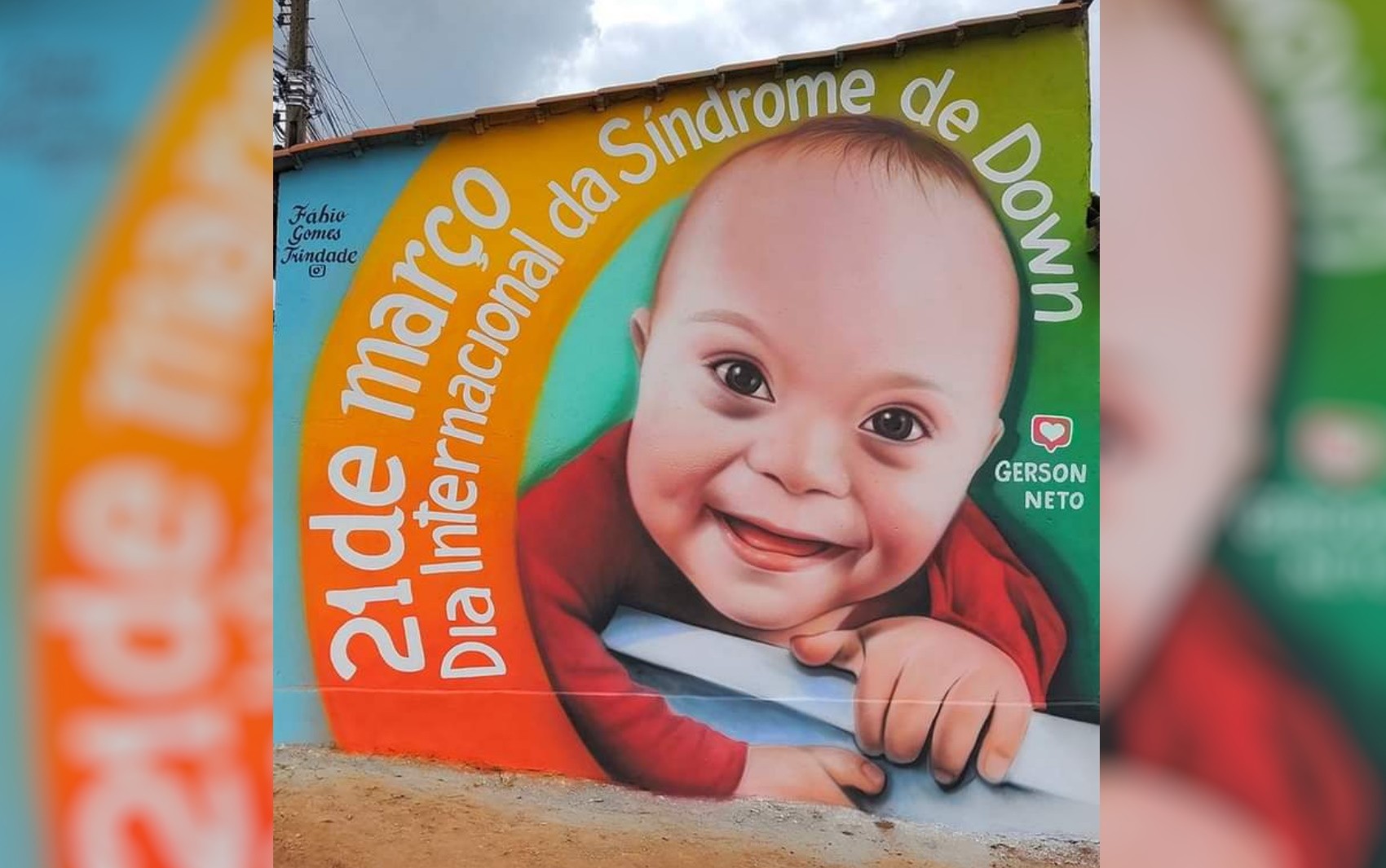 Bebê com Down inspira mural de conscientização sobre a síndrome e se encanta com a própria imagem, em Trindade