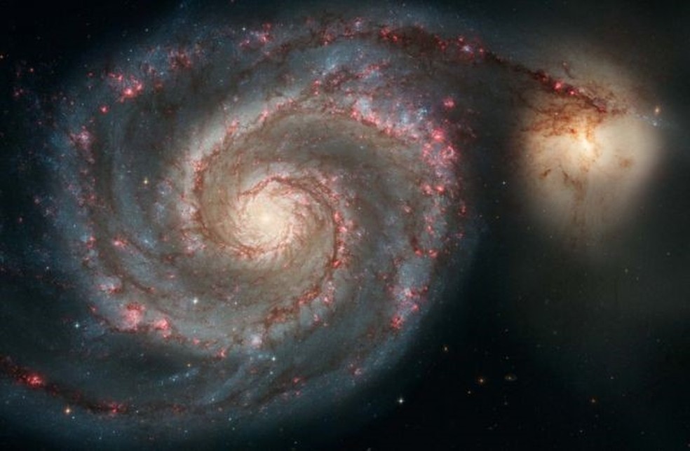 A galáxia Messier 51 está a cerca de 28 milhões de anos-luz da Via Láctea — Foto: NASA / ESA / S. BECKWITH / HHT