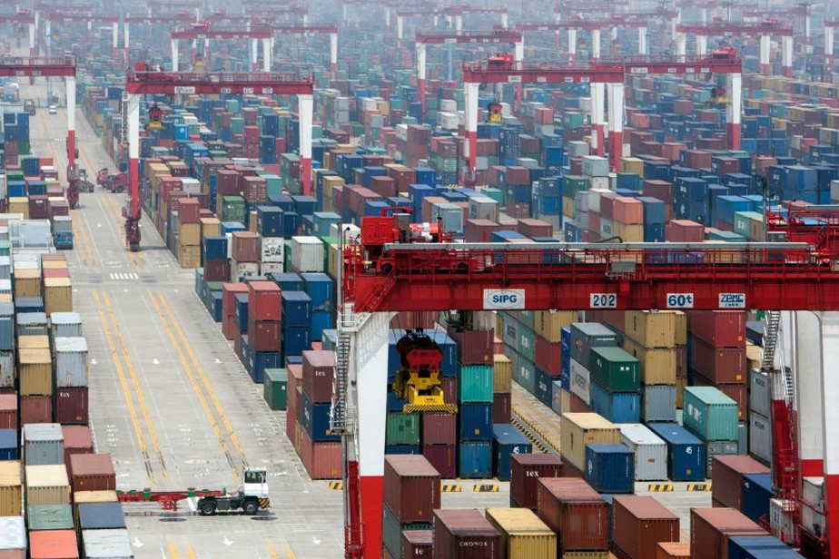 Shipping containers are stacked at the Yangshan Deep Water Port in Shanghai, China, on Friday, May 11, 2012. The leaders of China, Japan and South Korea agreed to start negotiations this year on a free-trade accord between three of Asia's four biggest economies.