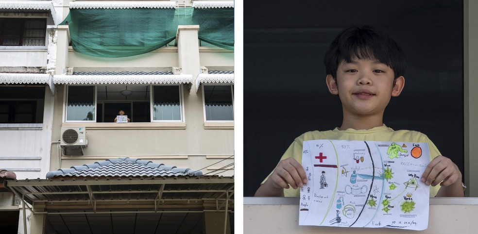 Nipoon Kitkrailard posa para foto mostrando o que desenhou durante o surto de doença por coronavírus (COVID-19) da janela de sua casa em Samut Prakan, na Tailândia — Foto: Athit Perawongmetha/Reuters