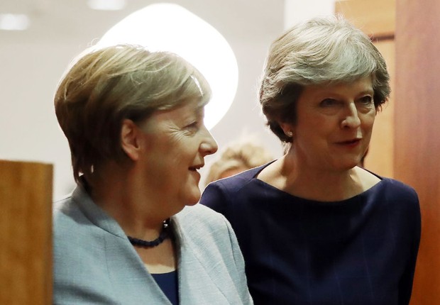 Angela Merkel ao lado de Theresa May: as duas mulheres mais poderosas do mundo, segundo a Forbes (Foto:  Dan Kitwood/Getty Images)