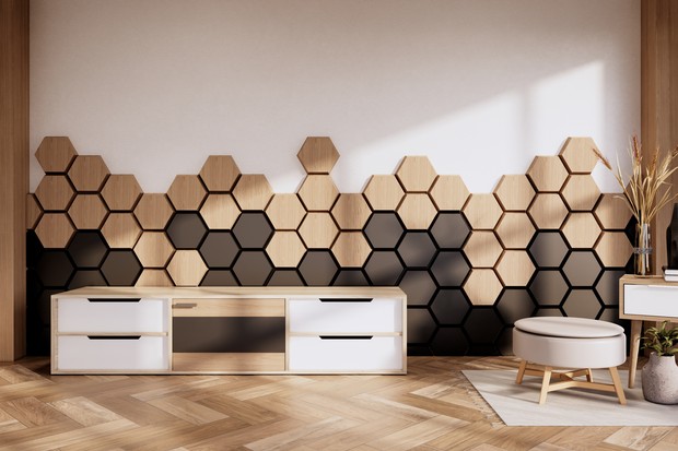 Armchair and cabinet ,decoration plants with hexagon tiles wooden and black   on wall Modern room minimalist.3D rendering (Foto: Getty Images/iStockphoto)