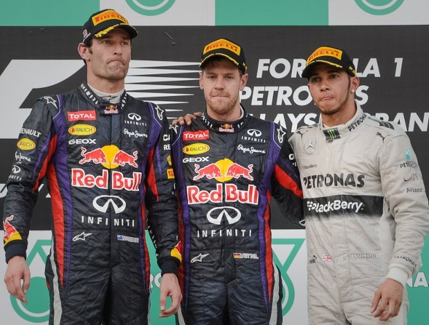 Mark Webber, Sebastian Vettel e Lewis Hamilton no pódio do GP da Malásia (Foto: AFP)
