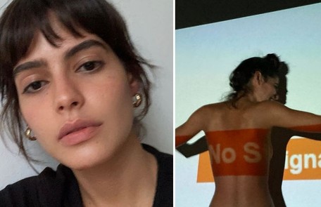 Julia Dalavia interpretará Guta na nova versão de 'Pantanal' e posou de topless diante de uma projeção Reprodução