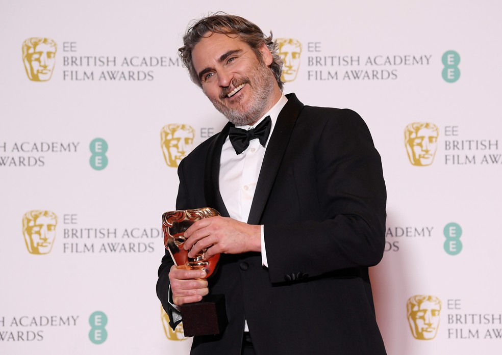 Joaquin Phoenix ganhou o prêmio de 'Melhor Ator' por Coringa — Foto: Toby Melville/Reuters