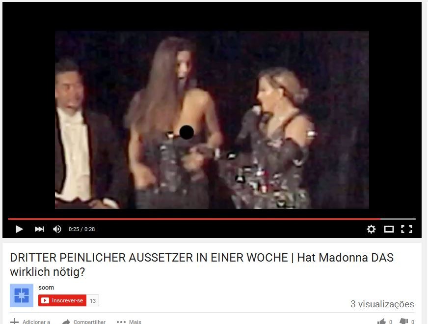 Madonna expõe seios de fã no palco (Foto: Youtube/Reprodução)