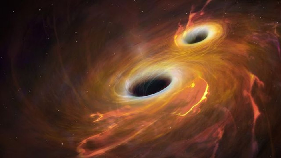 As ondas gravitacionais surgem após a colisão violenta entre dois objetos massivos, como buracos negros — Foto: Getty Images via BBC